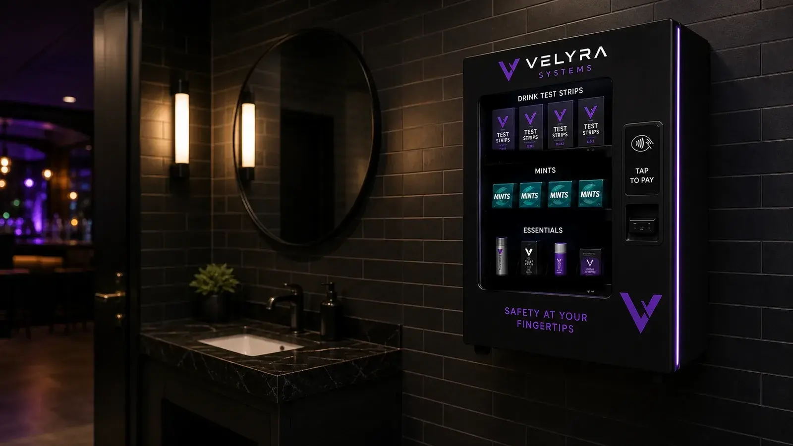 A Velyra drink-safety station mounted on the wall of an upscale, dimly lit bar restroom